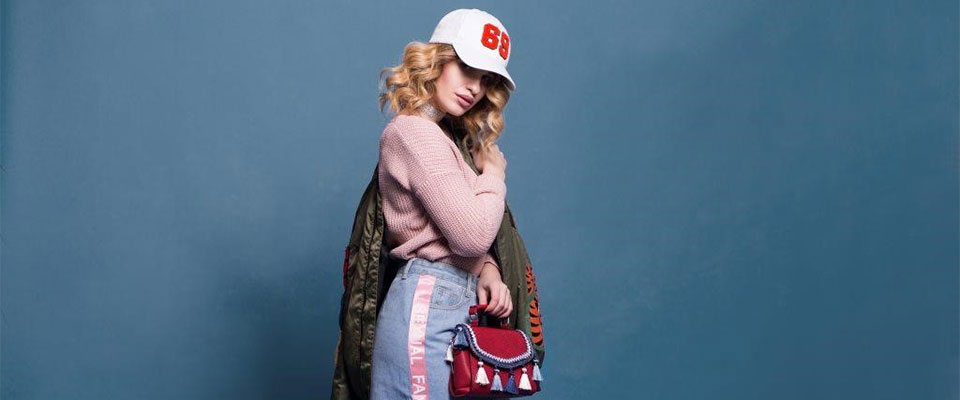 fashionable woman against a blue background