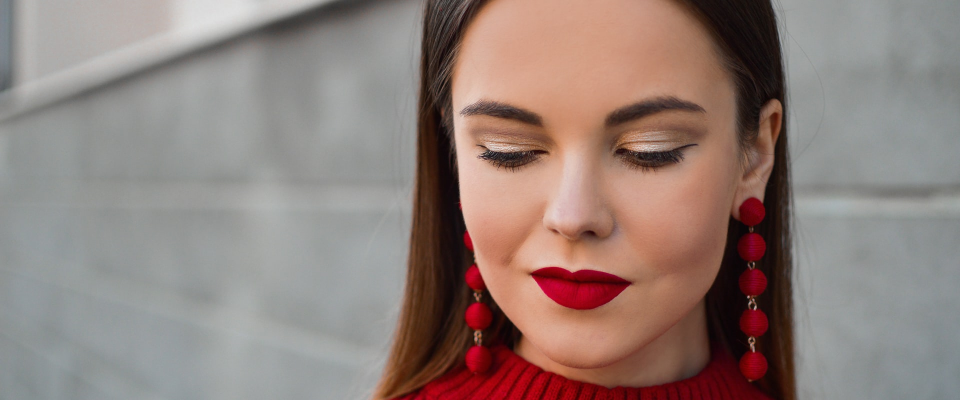 women with red lipstick and red jumper